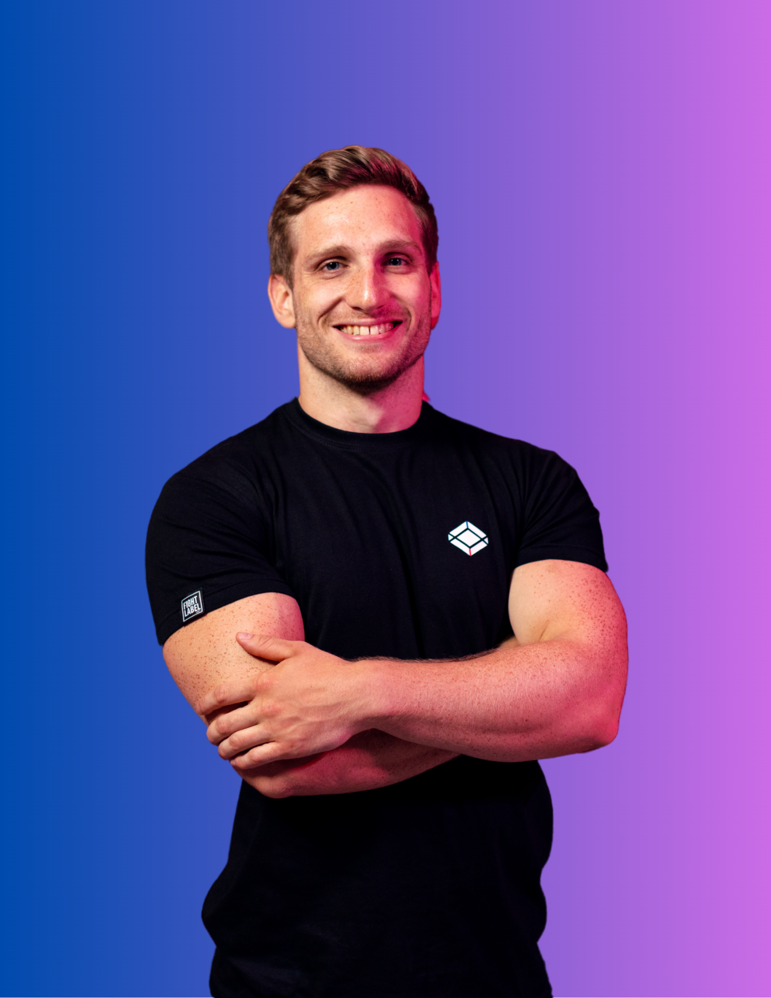 fitness trainer wearing all black crossing arms